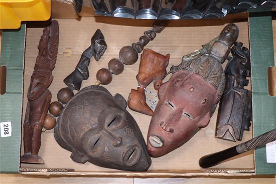 A Papua New Guinea large mask, other tribal masks and rattles